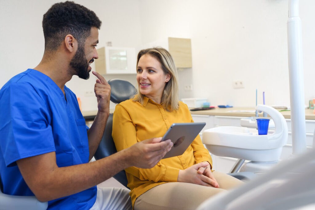 Young woman having consultation - Oral Plastic Surgery & Periodontics